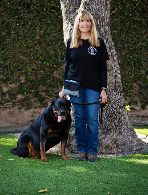 Karen Widaman with a trained dog at It’s A Dog’s World K-9 Academy
